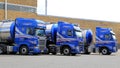 Fleet of Blue Tanker Trucks on a Yard